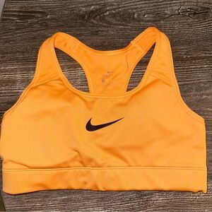 Orange Nike sports bra